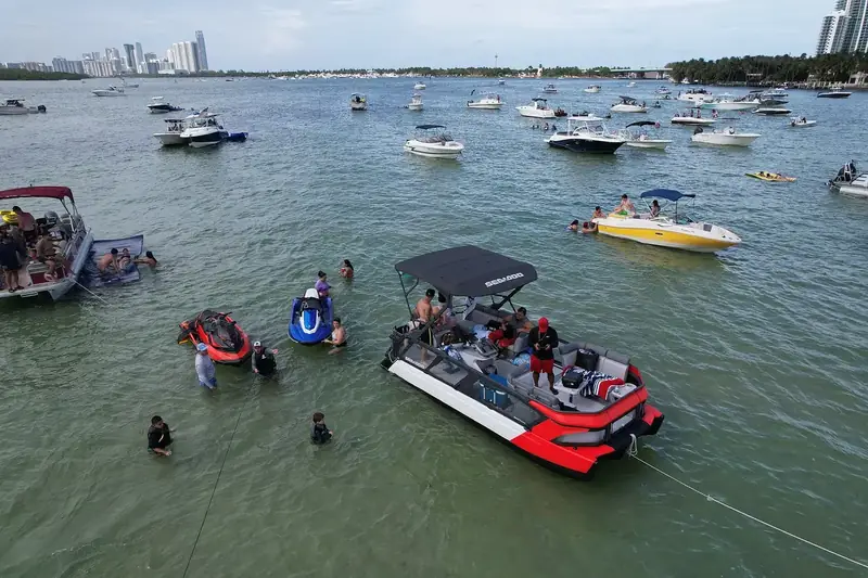 Boats anchored at a Miami sandbar on a sunny day